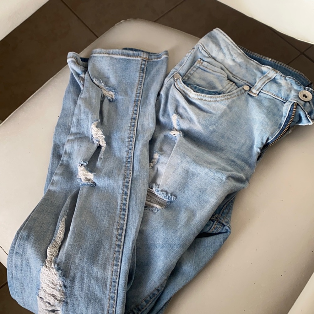 Light blue washed ripped jeans